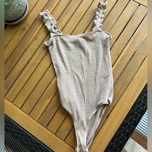 Tan size small bodysuit purchased from a boutique